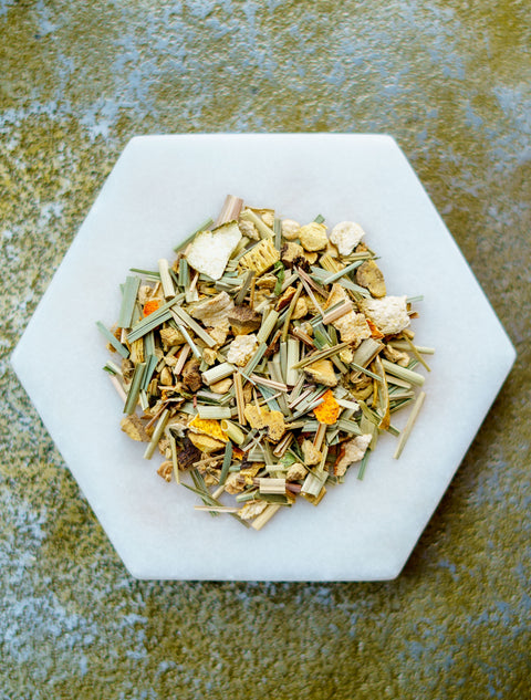 mix of lemongrass specialty tea herbs on a white plate.