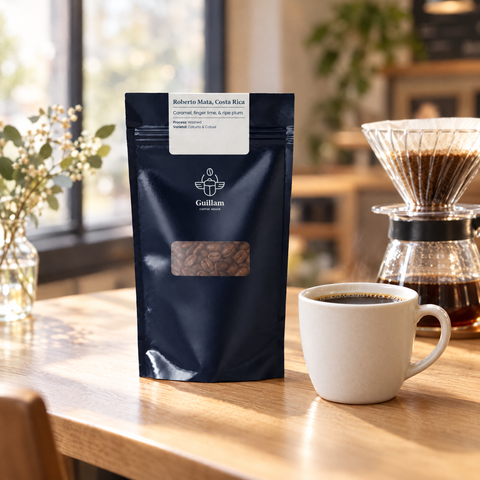 Roberto Mata speciality coffee bag beside a pour-over and a cup in a café