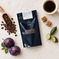 Roberto Mata speciality coffee flat lay with caramel, finger limes and plums